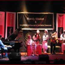 Pianist Randy Weston playing with Gnawa musician Abdellah El Gourd (far right) in Tangier, Morocco, at Performing Tangier 2008.